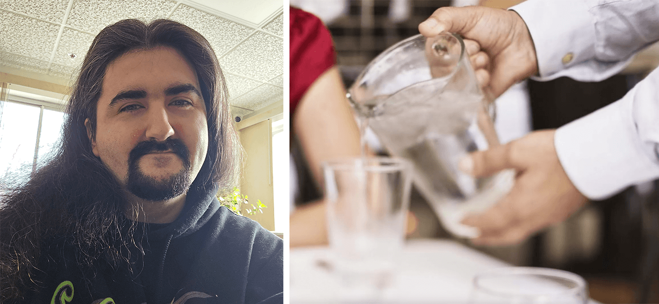 On the left is a male smiling and on the right is a waiter serving water into a glass.