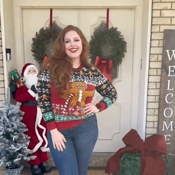 A female wearing a holiday sweater