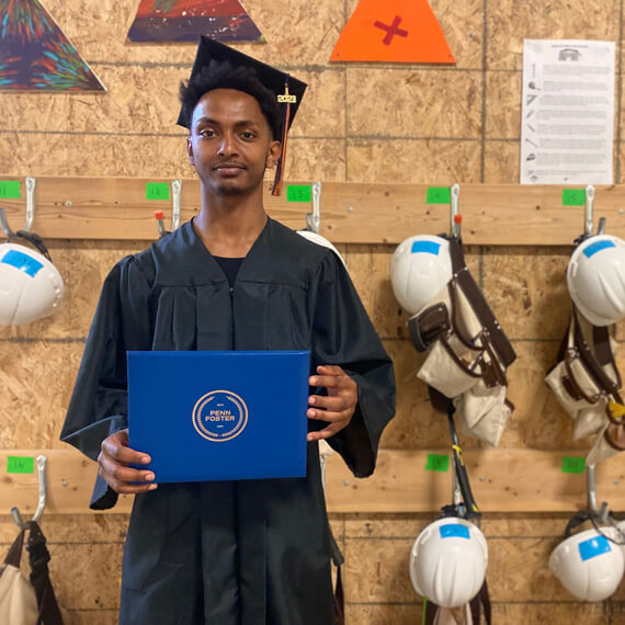 boy-holding-high-school-diploma