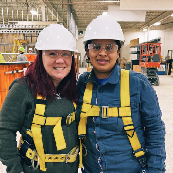 women standing next to each other