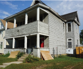 An older photo of the side of the Marg house before renovation.